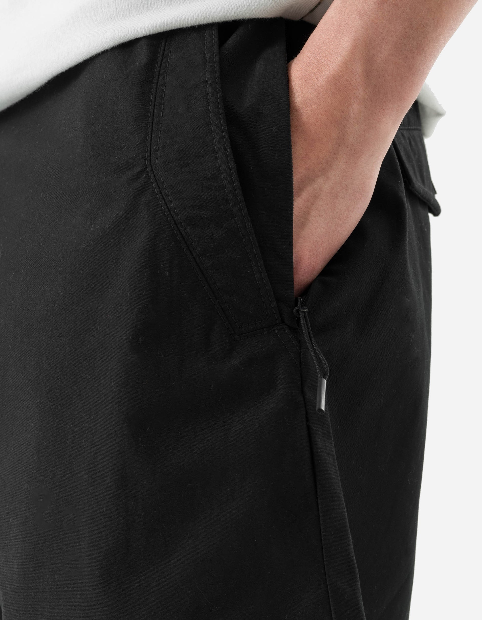 Black pants with a brand logo on a white background