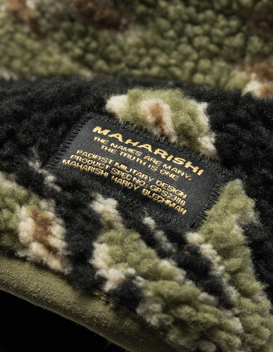 Camouflage fabric with a visible 'Maharishi' label