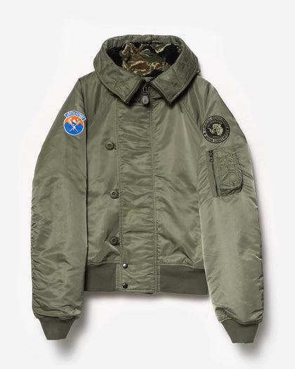 Green jacket with patches on a white background