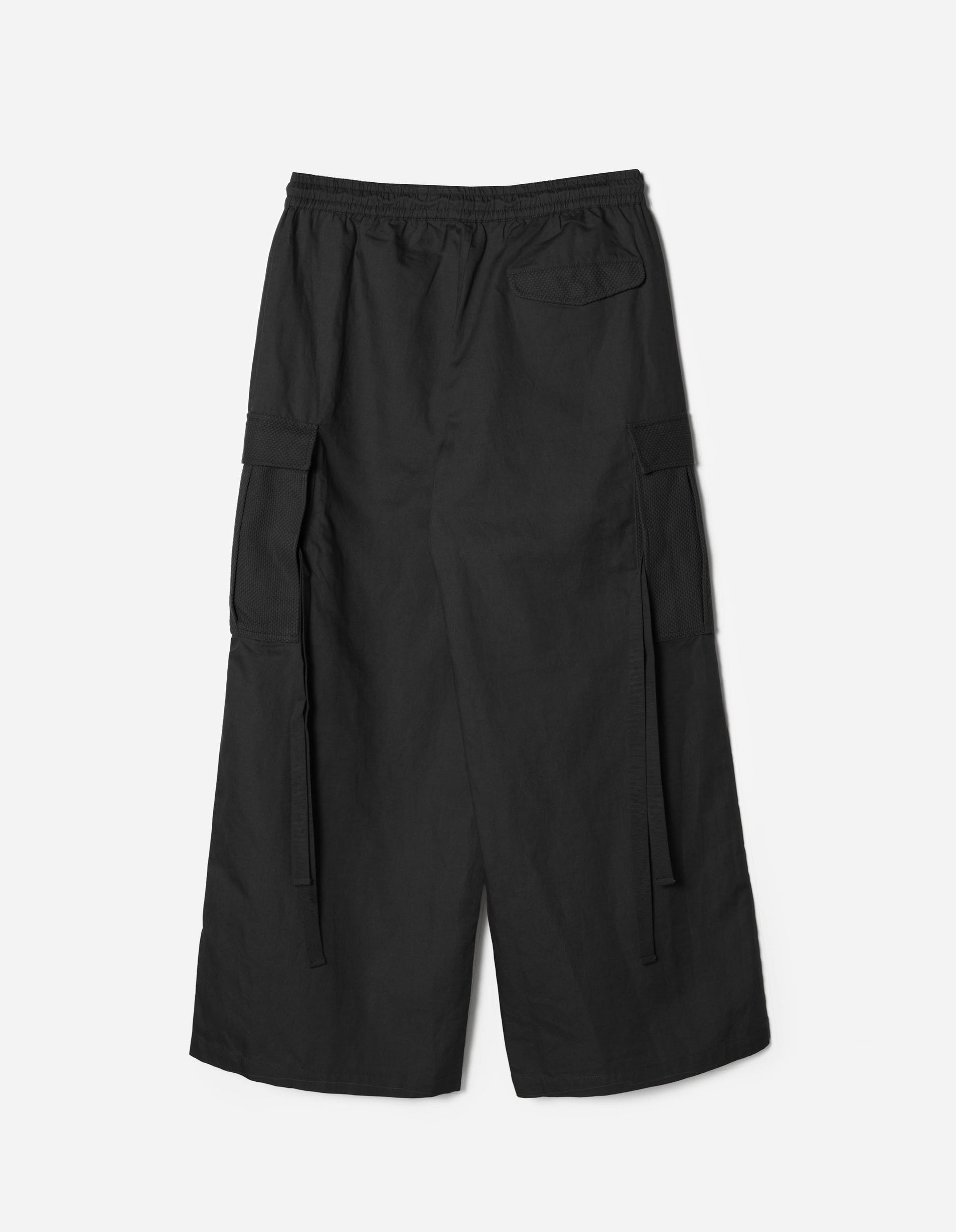 Black wide-leg pants on a light gray background