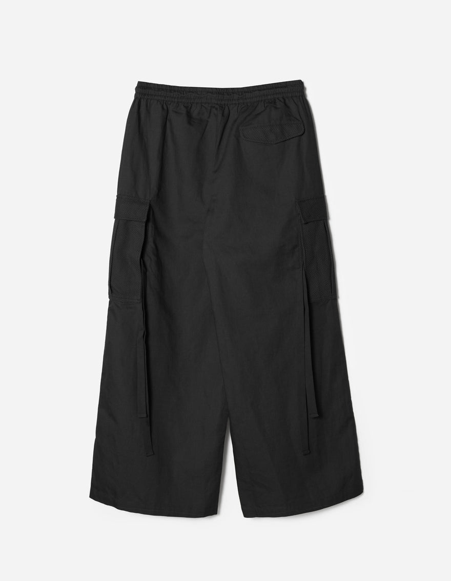Black wide-leg pants on a light gray background