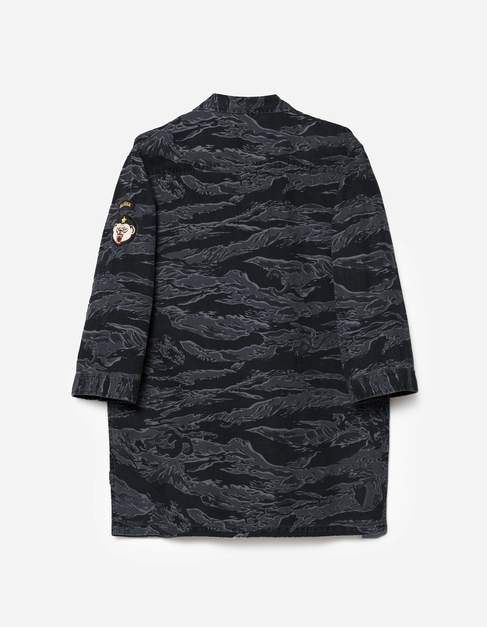 Black camouflage dress on a light gray background
