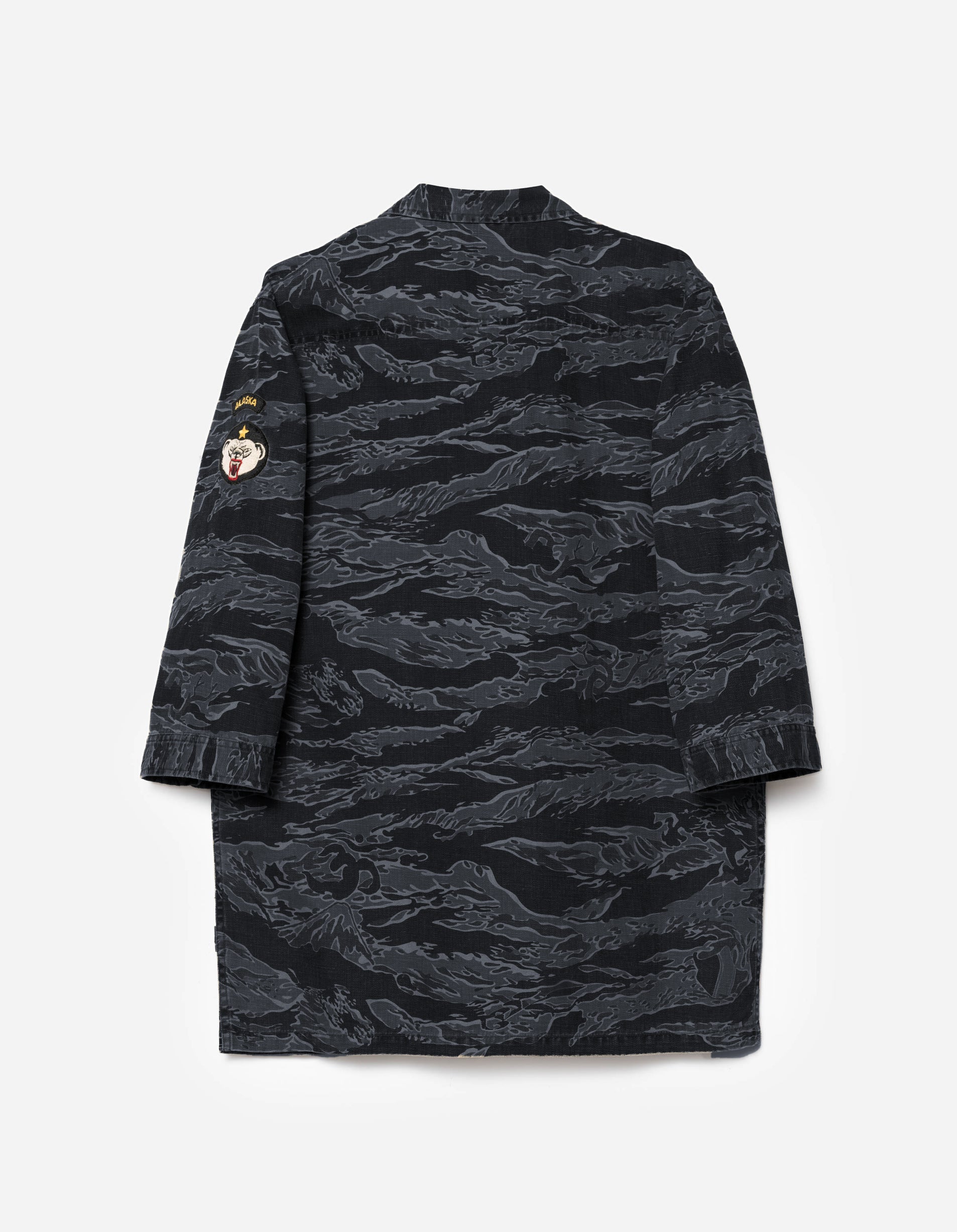 Black camouflage dress on a light gray background