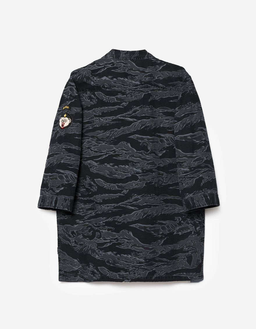 Black camouflage dress on a light gray background