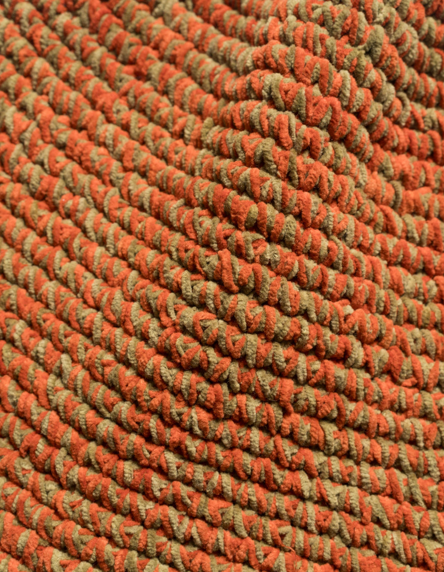 Close-up of a textured orange and green fabric pattern