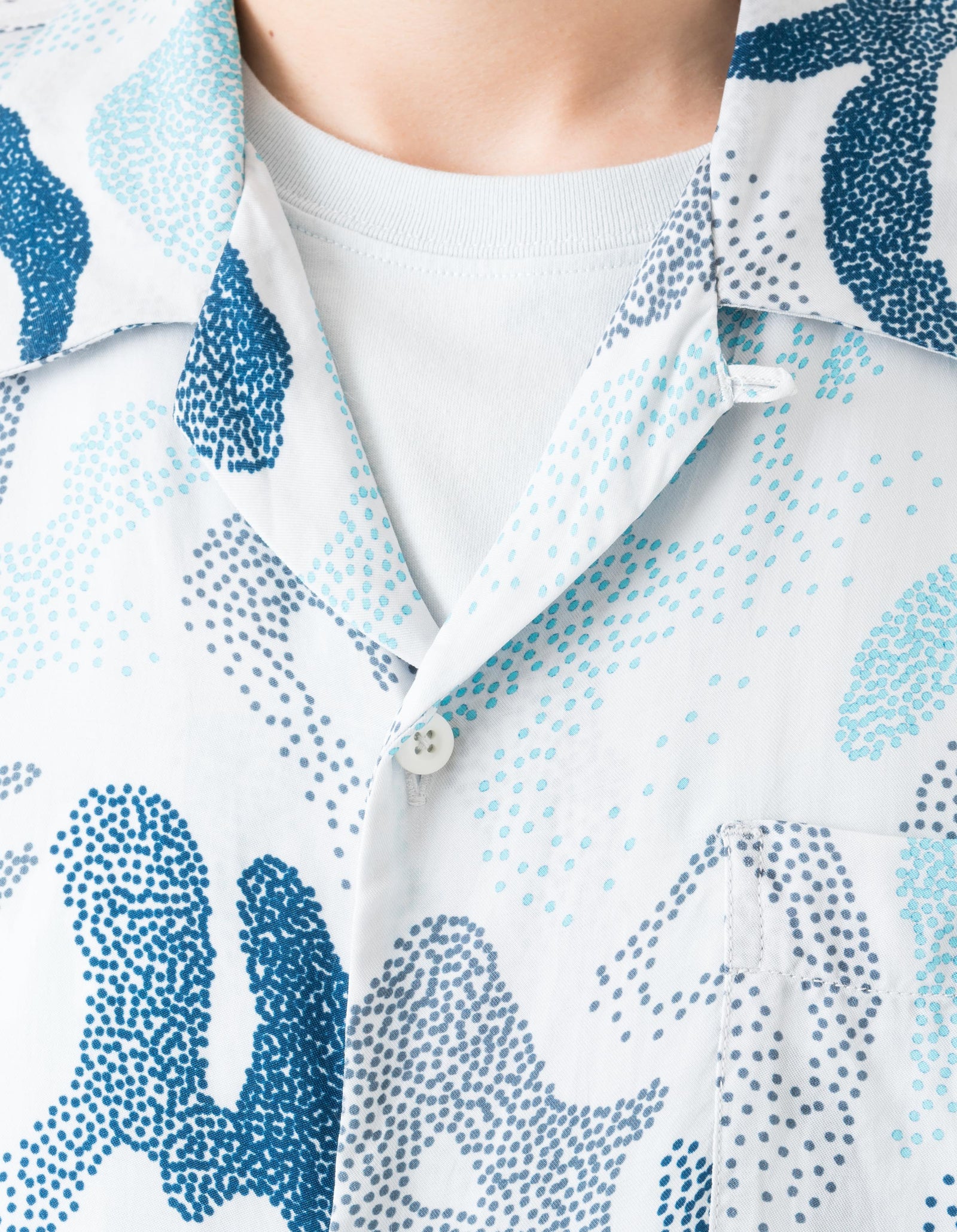 Close-up of a patterned shirt with blue and white design