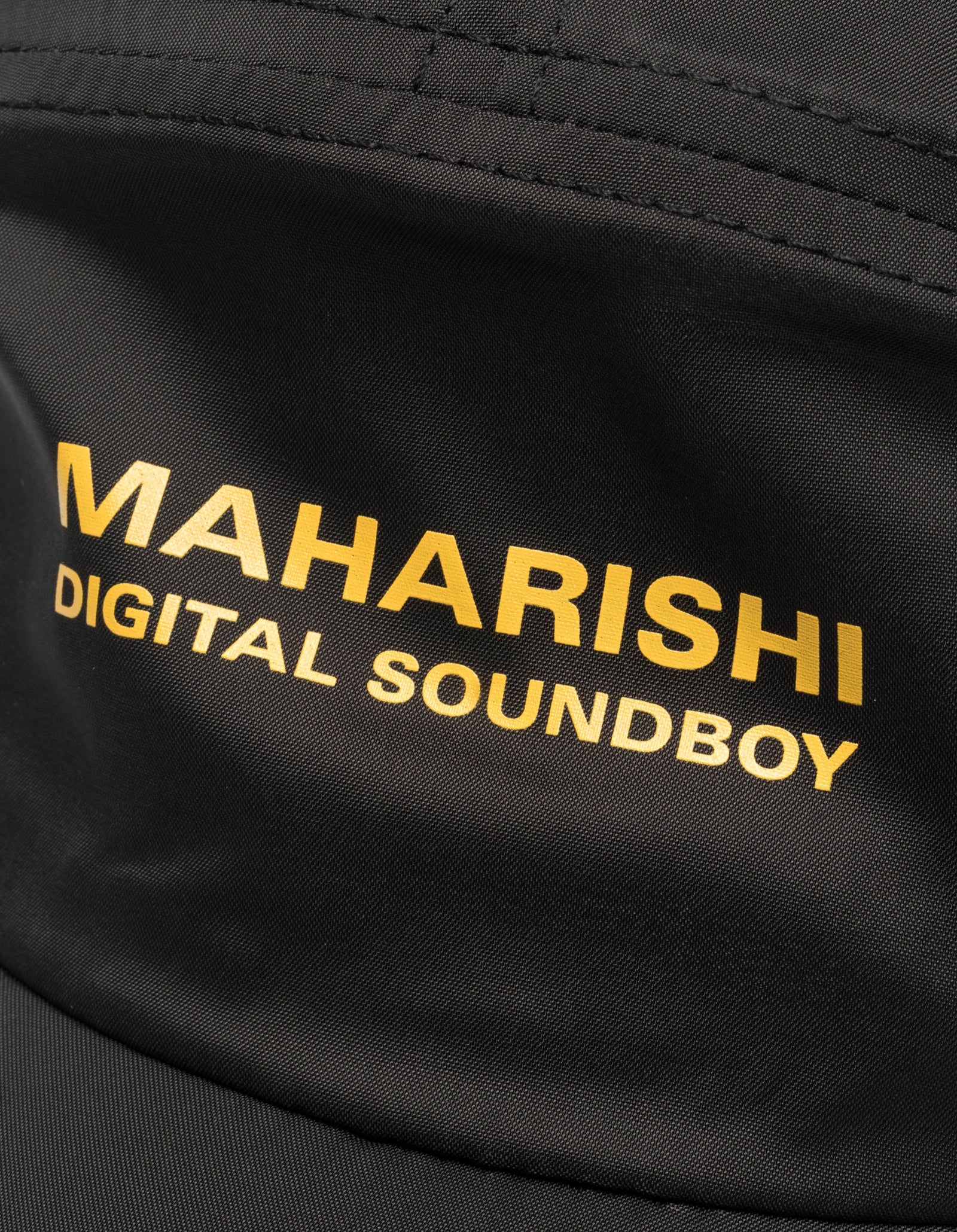 Black bag with 'MAHARISHI DIGITAL SOUNDBOY' text in yellow on a close-up view.