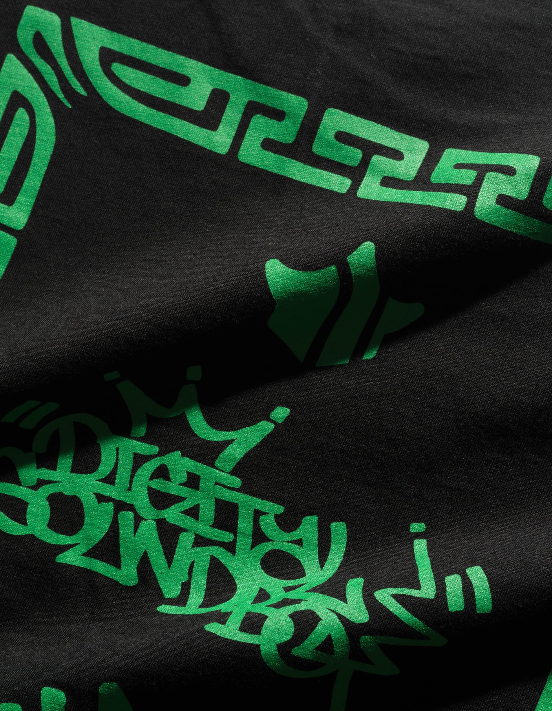 Black fabric with green geometric patterns