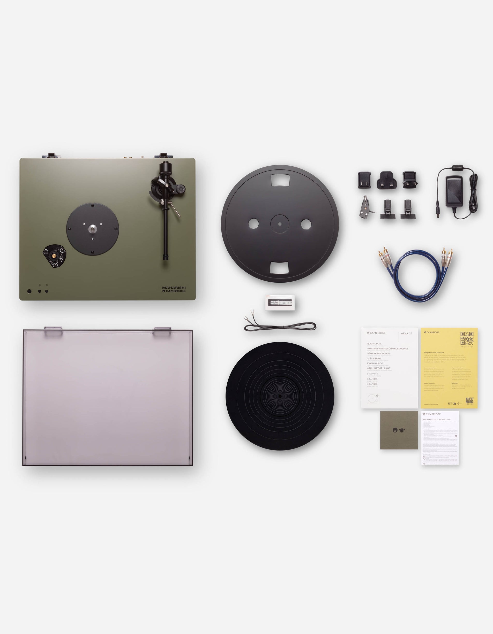 Collection of vinyl record player parts and accessories on a white background
