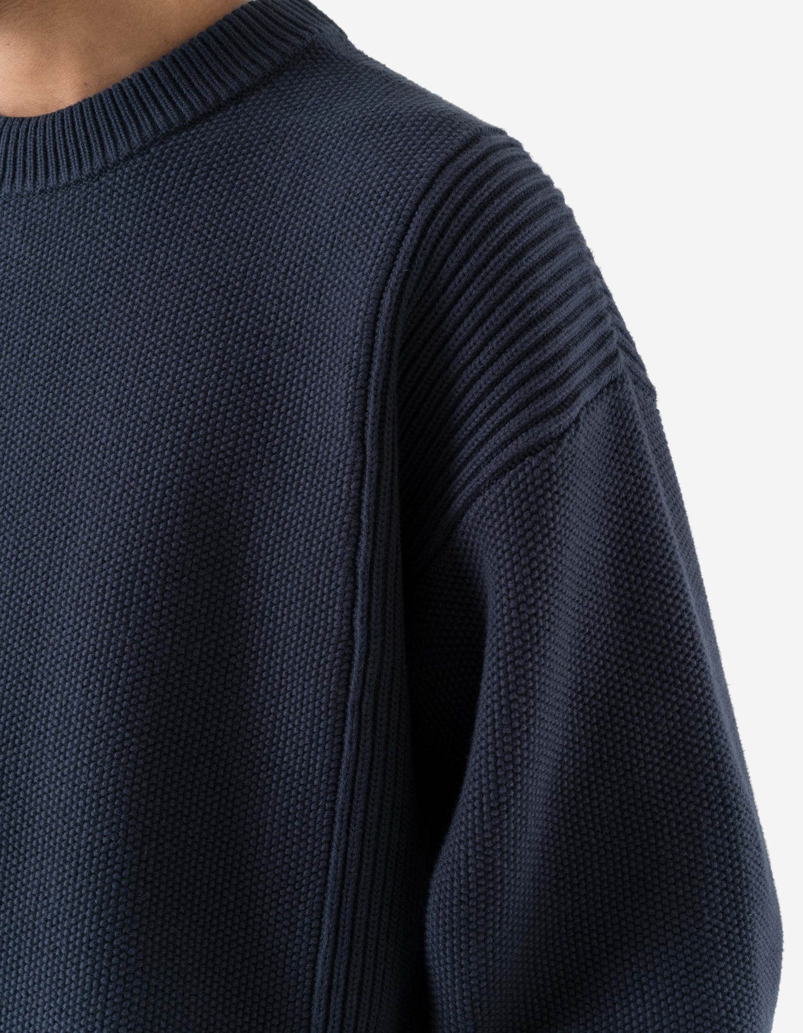 Navy blue sweater on a white background