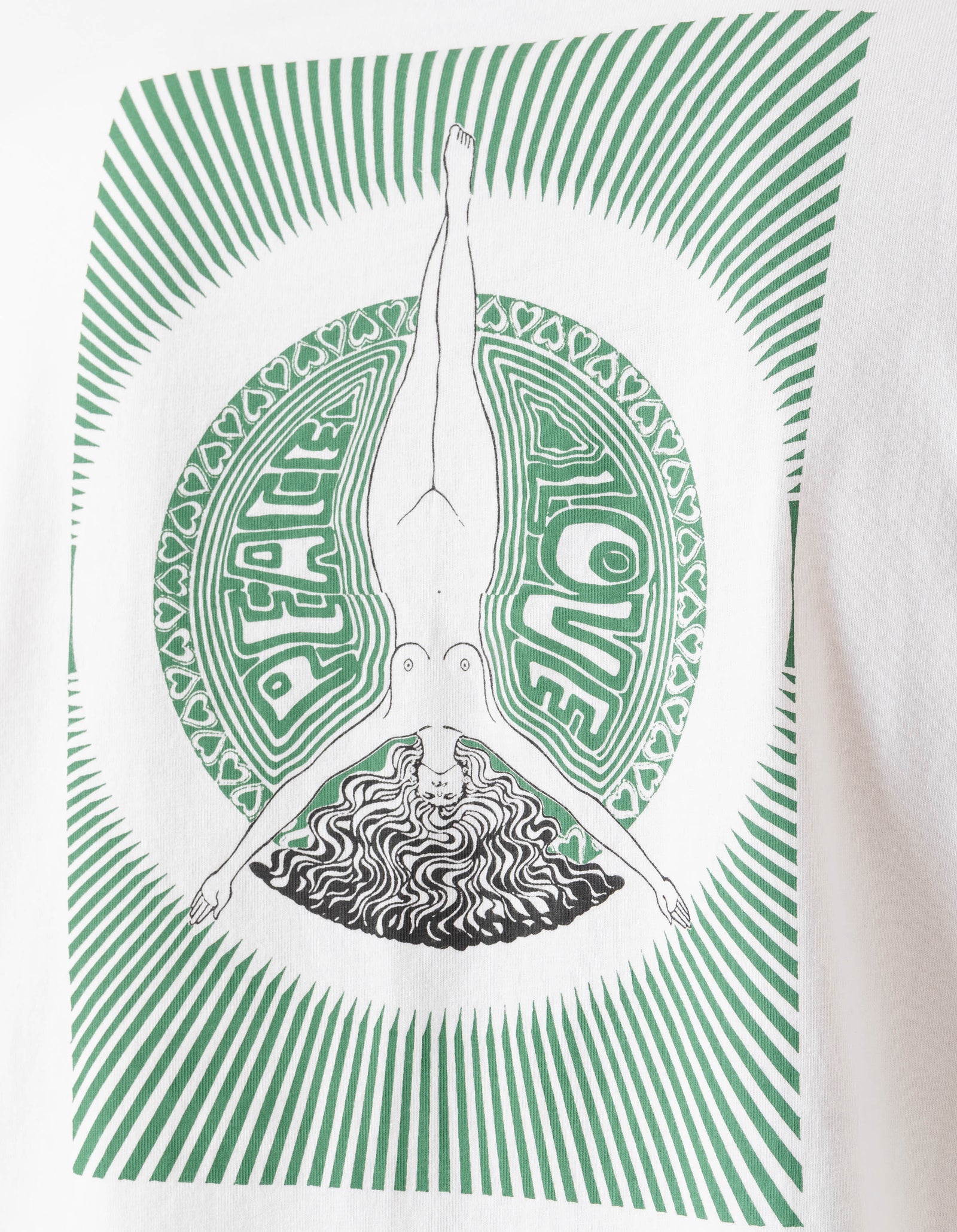 White t-shirt with green and black graphic design of a person in a handstand and the word 'PEACE'.