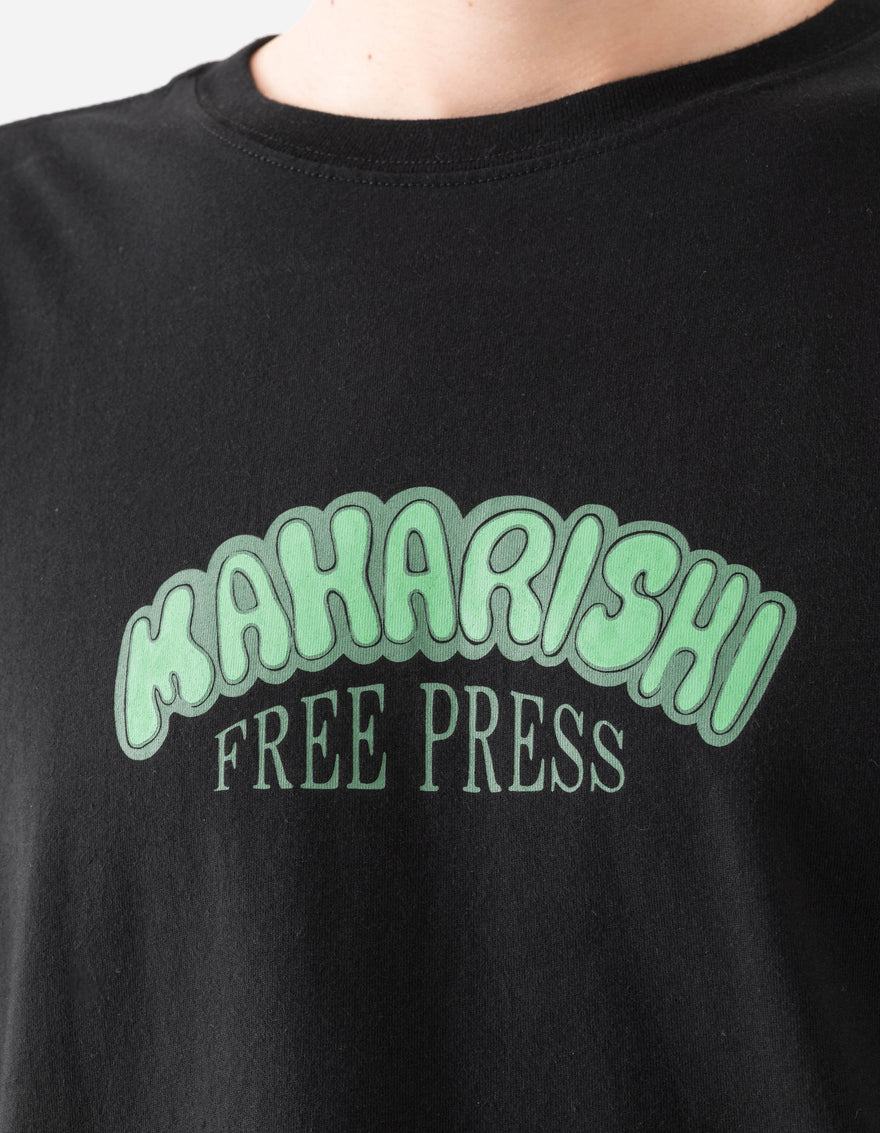 Black t-shirt with green 'Maharishi Free Press' text