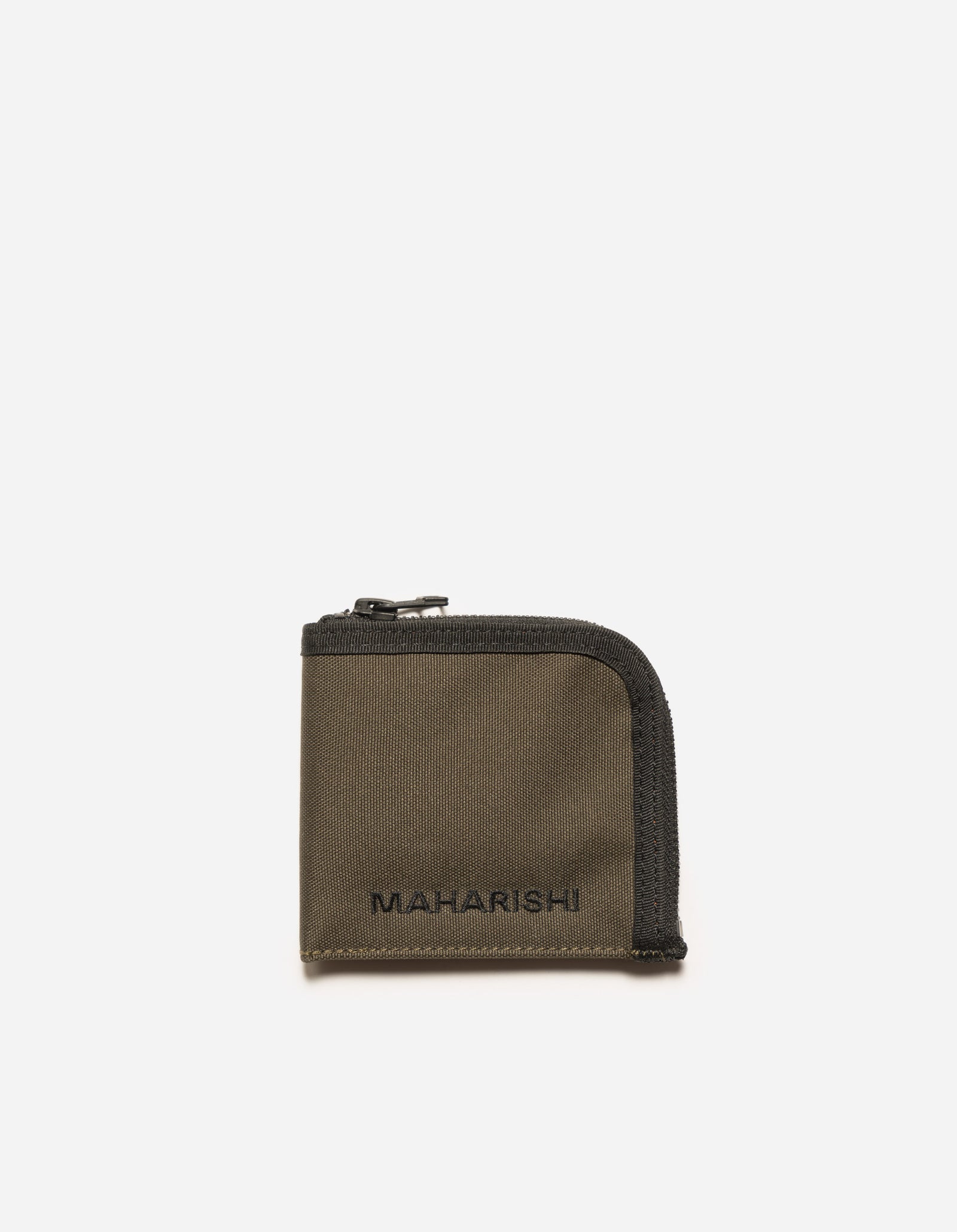 A compact zip-around wallet in olive color with the Maharishi brand name embroidered on it.