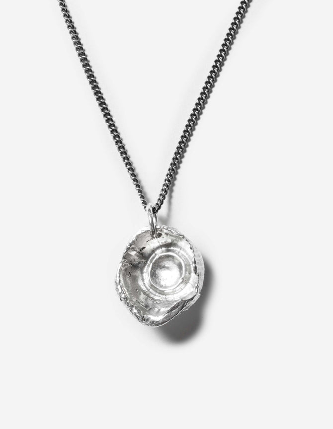 Silver pendant necklace on a white background